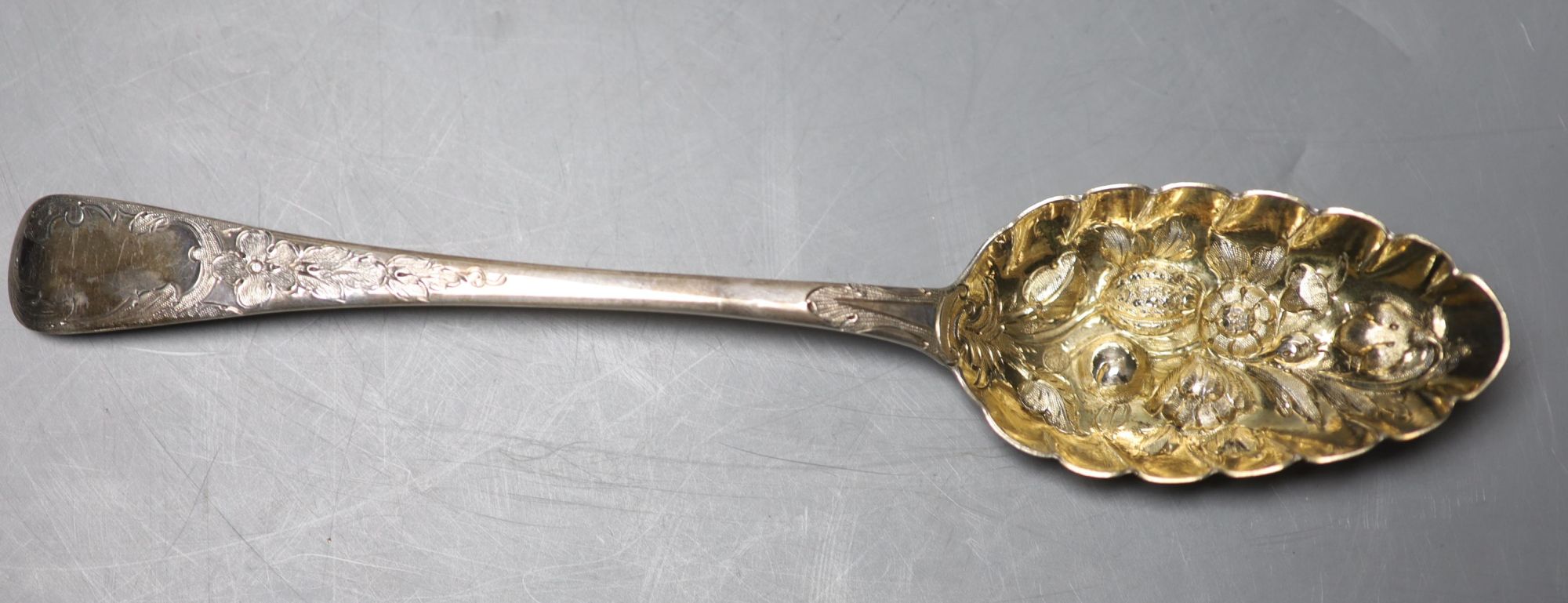 A pair of George III later embossed berry spoons, John Lias, London, 1817, 22.5cm